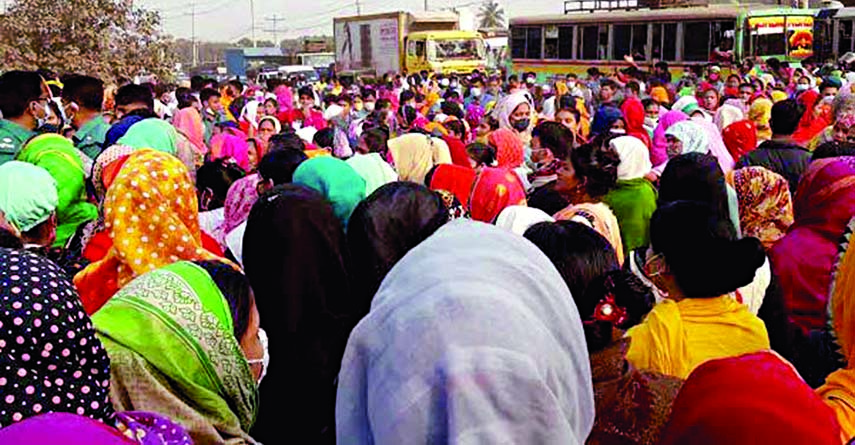 Apparel workers take to Dhaka-Gazipur Road at Laxmipura area under Gazipur City Corporation for the third consecutive day on Saturday, demanding payment of their arrear salaries.