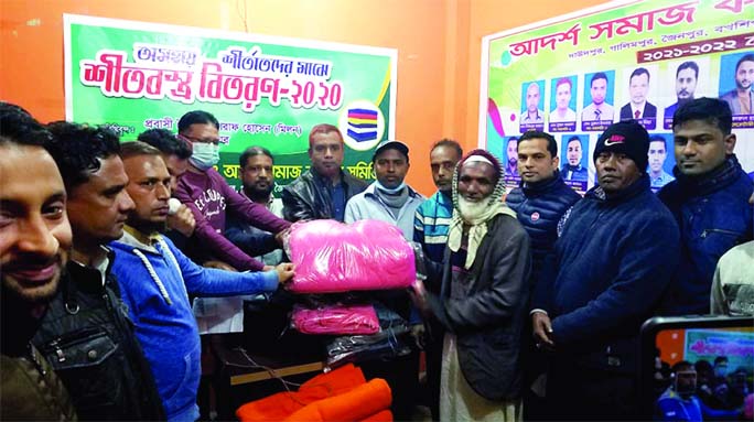 Sylhet's Surma Upazila Education officer distributes new books to the authorities of local schools at a ceremony on the upazila parishad premises on Sunday.