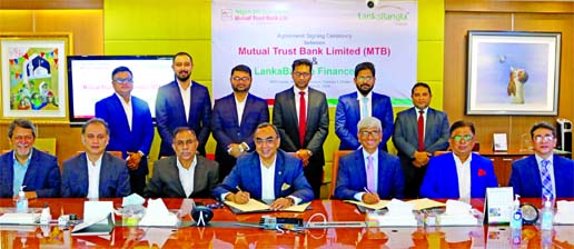 Khwaja Shahriar, Managing Director & CEO of LankaBangla Finance Limited (LBFL) and Syed Mahbubur Rahman, Managing Director and CEO of Mutual Trust Bank Limited (MTBL), exchanging a MoU signing document at the bank head office in the city recently. Under t