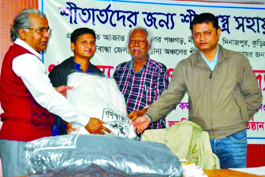 Founder of Ganoswasthya Kendra Dr. Zafrullah Chowdhury distributes winter cloths among the cold-hit poor people on the premises of Ganoswasthya Nagar Hospital in the city's Dhanmondi on Monday.