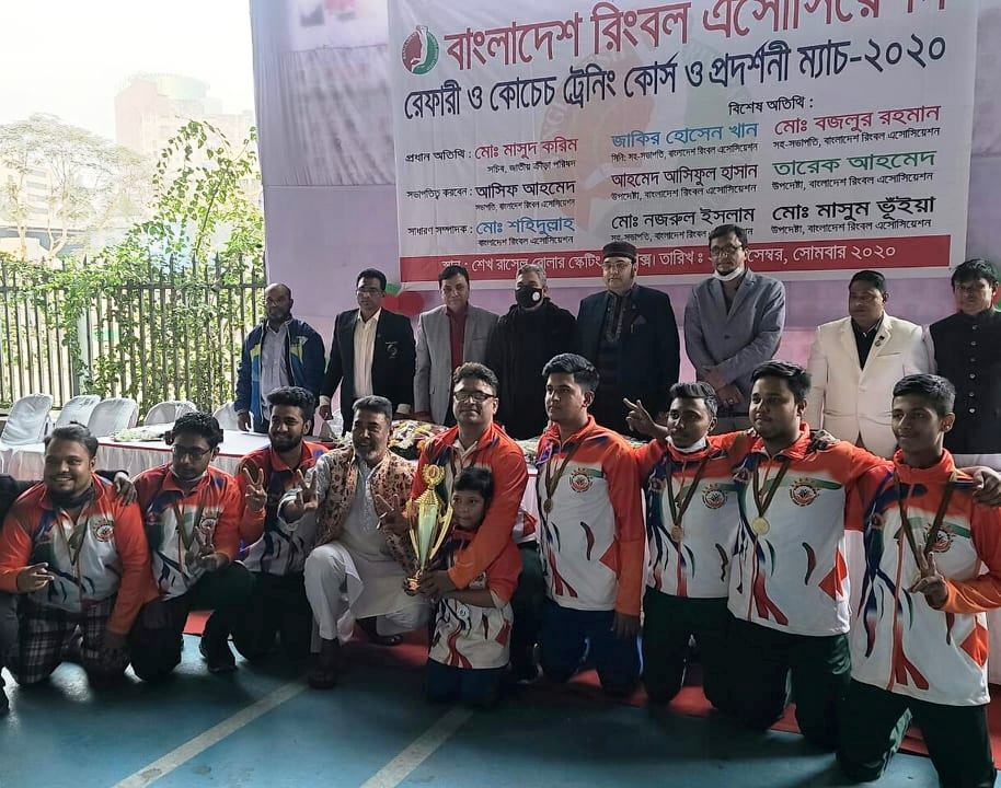 Golam Mostafa Lane Panchayat XI players celebrate winning the Ringball friendly match 2020 at Sheikh Russell Roller Skating Complex Bangabandhu National Stadium, Dhaka on Monday.