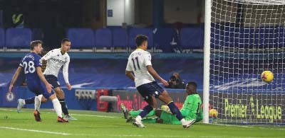 Aston Villa's striker Anwar El Ghazi (second left) shoots to score the equalising goal past Chelsea's goalkeeper Edouard Mendy (right) during the English Premier League football match at Stamford Bridge in London on Monday.