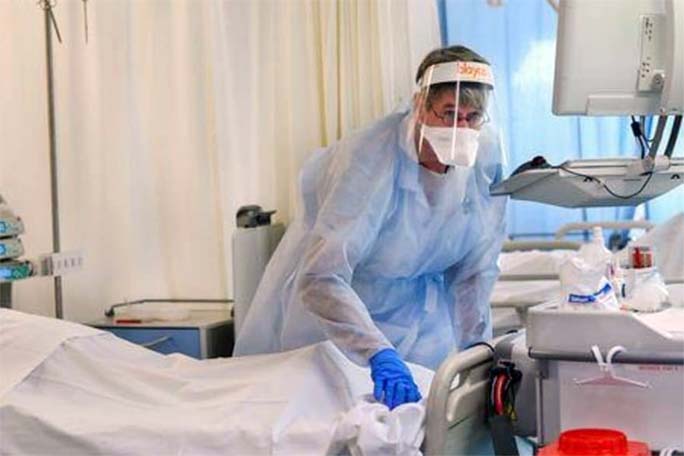 A member of the medical personnel wearing a full protective suit works in the intensive care unit at Maastricht UMC+ Hospital, where patients suffering from the coronavirus are treated, in Maastricht, Netherlands.