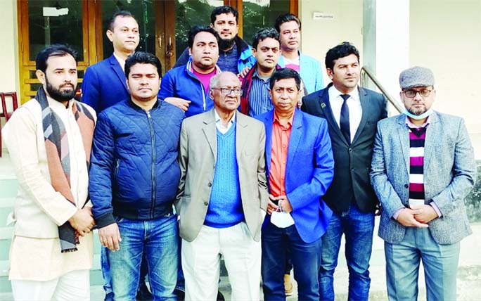 Newly elected office bearers of Feni Press Club pose for a photograph after an election held at the press club office on Monday.