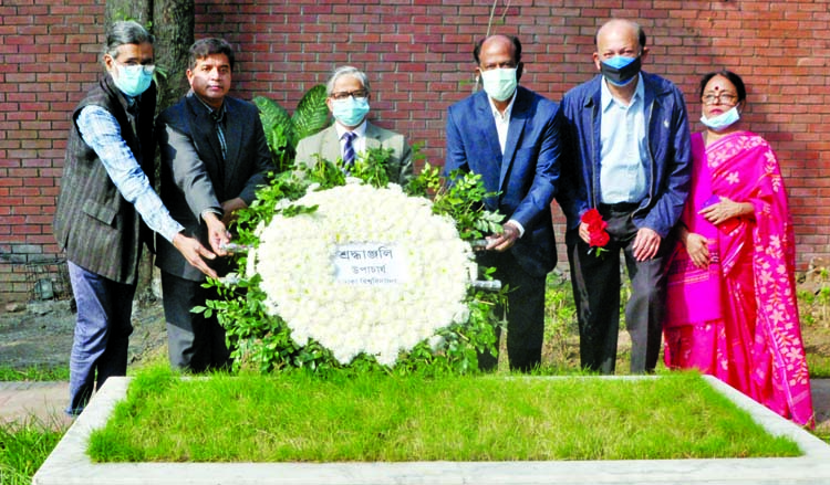 Vice-Chancellor of Dhaka University Prof Dr. Md. Akhtaruzzaman along with others pays floral tributes at the Mazar of Shilpachariya Zainul Abedin marking the latter's 106th birth anniversary.