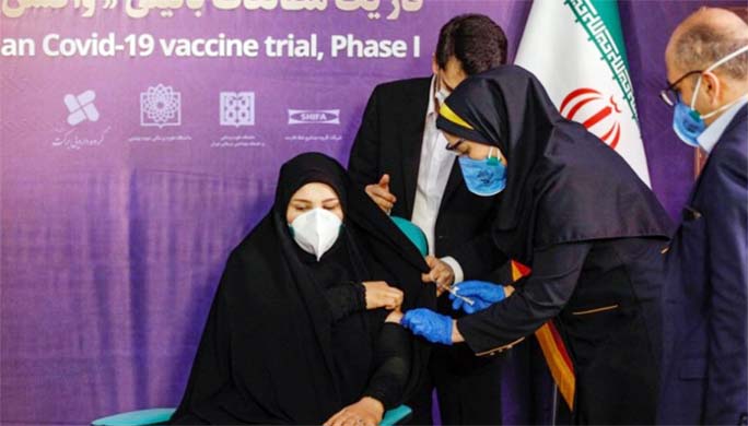 Tayebeh Mokhber is injected with the Coviran coronavirus vaccine produced by Shifa Pharmed, part of a state-owned pharmaceutical conglomerate, in a ceremony in Tehran, Iran.