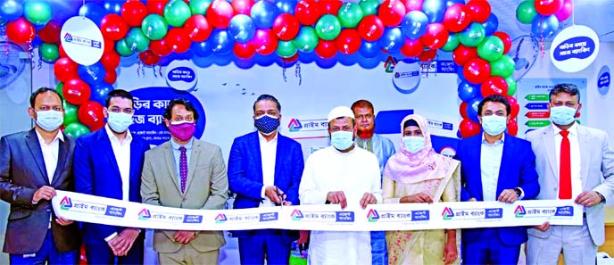 ANM Mahfuz, Head of Consumer Banking of Prime Bank Limited, inaugurating its agent banking outlet at Khilkhet in the city on Wednesday. High officials of the bank along with local elites were also present.