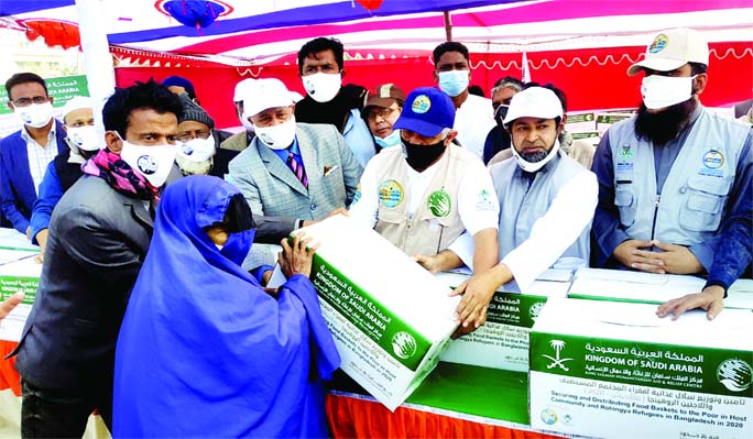 Food items sent by Saudi King distributed among the people of sadar upazila area in Naogaon district on Thursday in collaboration with the local voluntary organization Almanahil World Fair Foundation. Chairman of Sadar Upazila Parishad Rafiqul Islam, Alma