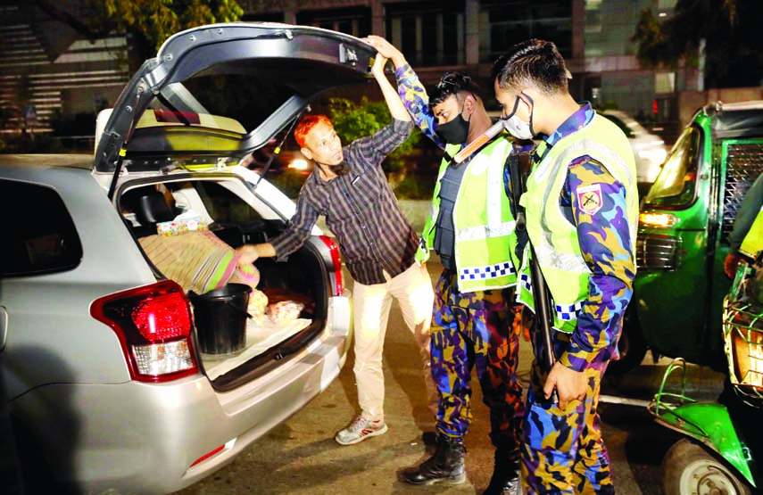 Police personnel check a car in the capital's Gulshan area on the New Year's Eve to avert any untoward situation.