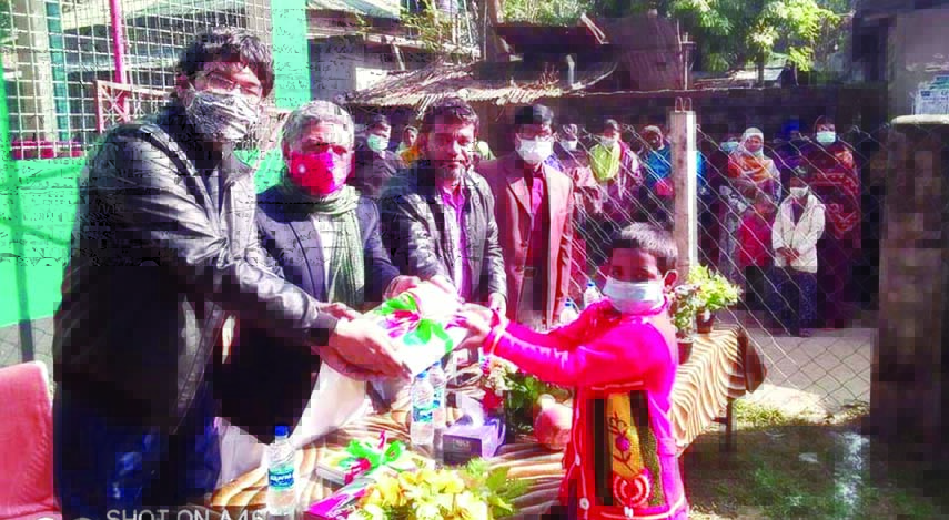 Chatmohar upazila (Pabna) Chairman Abdul Hamid and UNO Saikat Islam distribute textbooks among the students of Chatmohar Model Government Primary School on Friday marking the book festival across the country on the first day of New Year.