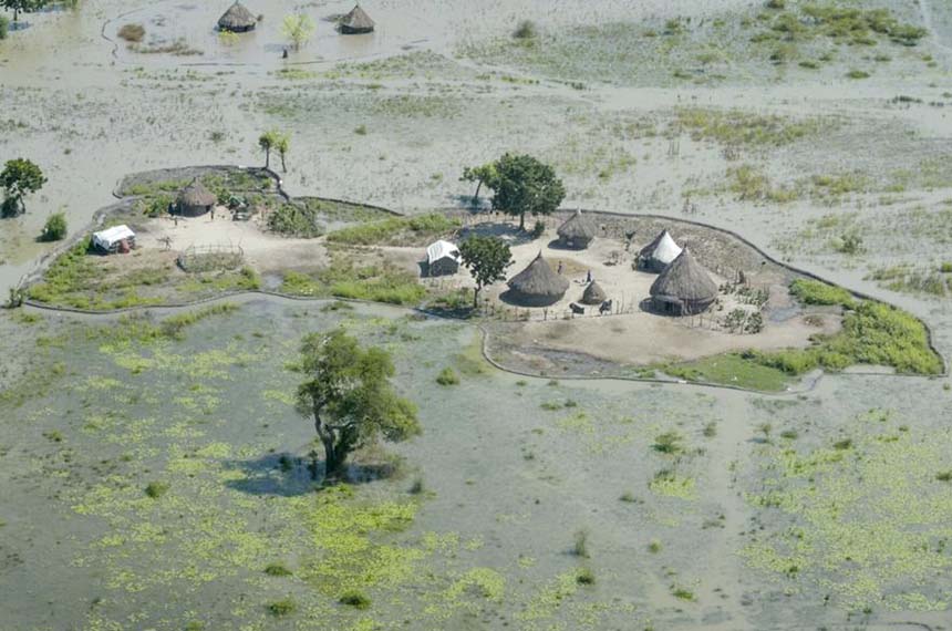 Thatched huts surrounded by floodwaters are seen from the air in Old Fangak county, Jonglei state, South Sudan.