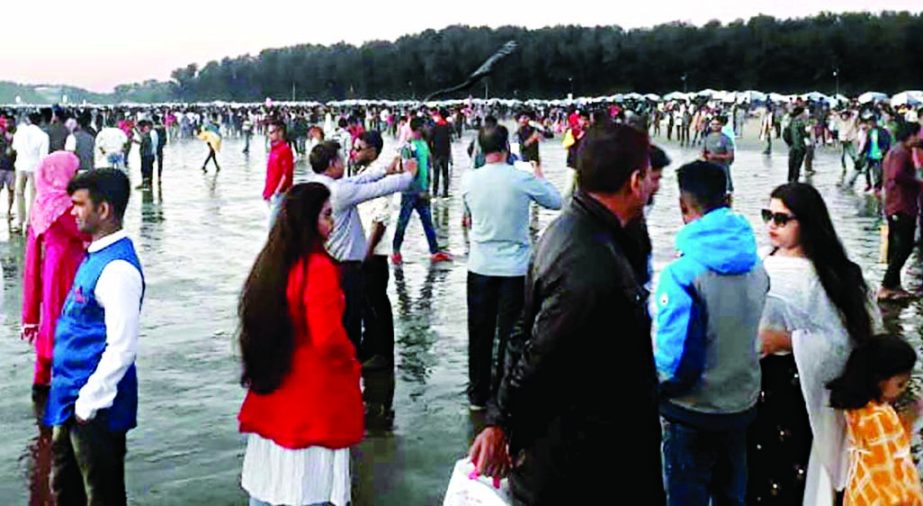 Tourists throng Cox's Bazar sea beach to celebrate the first day of New Year amid coronavirus outbreak. This photo was taken on Friday.