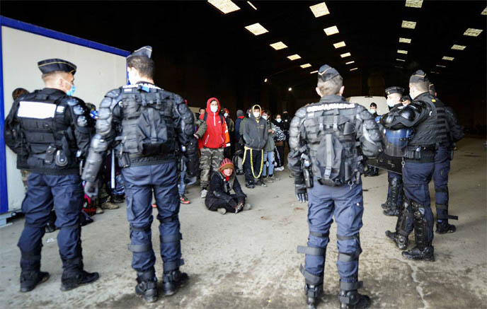 French Gendarmes break up a rave near a disused hangar in Lieuron about 40km (around 24 miles) south of Rennes, on Saturday.