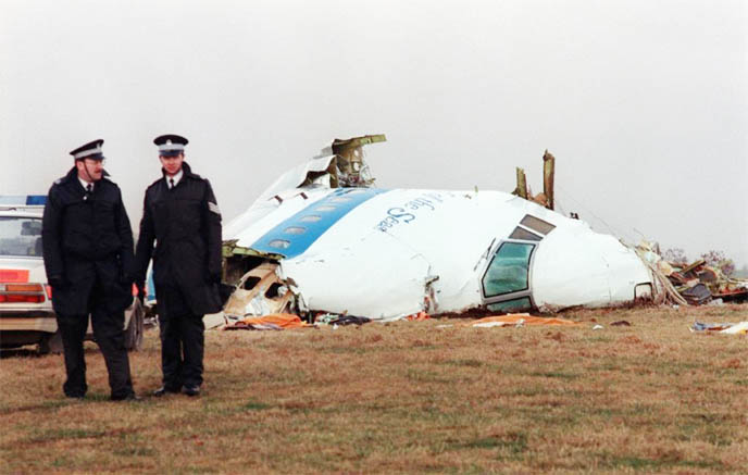 Policemen stand near the wreckage of the 747 Pan Am airliner that exploded and crashed over Lockerbie, Scotland.