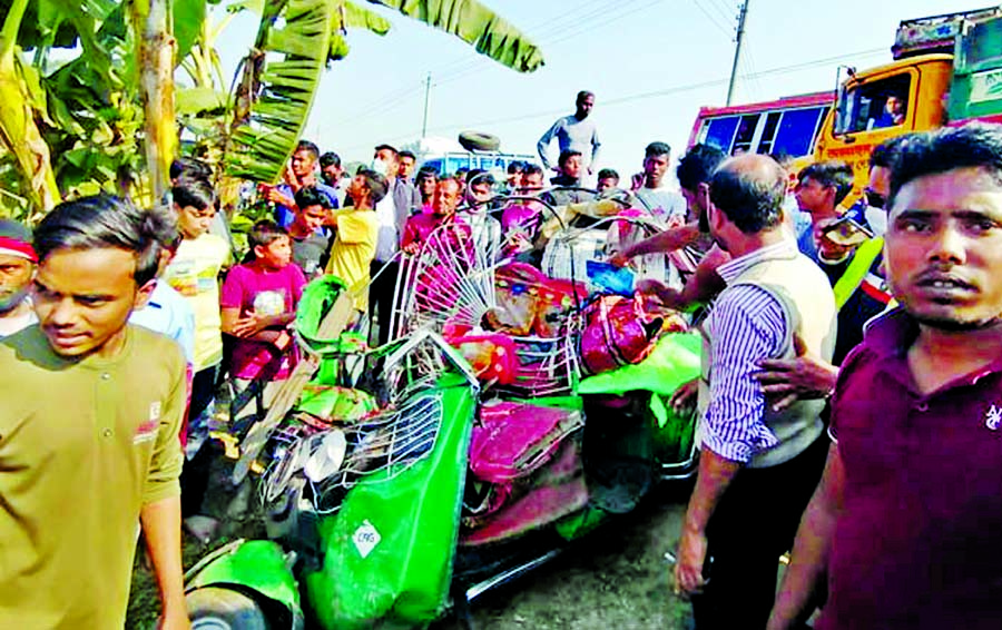 Crowd look over wreckage of the CNG-run auto-rickshaw after a bus crashed into it on Mymensingh-Netrakona road at Gachhtola in Tarakanda upazila of Mymensingh on Sunday, killing seven people dead on the spot.