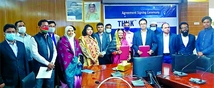 Hosne Ara Begum, Managing Director of Bangladesh Hi-Tech Park Authority and Ashikur Tanim, Director and Co-founder of Think Group, pose for a photograph after signed a MOU on behalf of their respective organizations at ICT Tower in the city on Monday. The