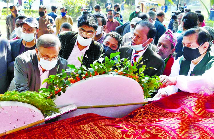 Information Minister Dr. Hasan Mahmud pays floral tributes on the coffin of novelist Rabeya Khatun on Bangla Academy premises in the city on Monday.