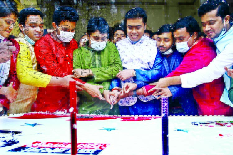 BCL President Al Nahiyan Khan Joy, along with other leaders cuts cake on the premises of Curzon Hall of Dhaka University on Monday marking the 73rd founding anniversary of the organisation.