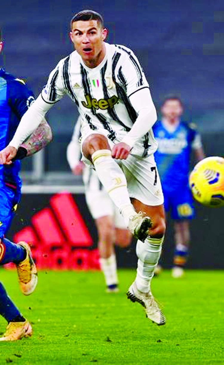 Juventus' forward Cristiano Ronaldo shoots during the Italian Serie A football match against Udinese at the Juventus stadium in Turin on Sunday.