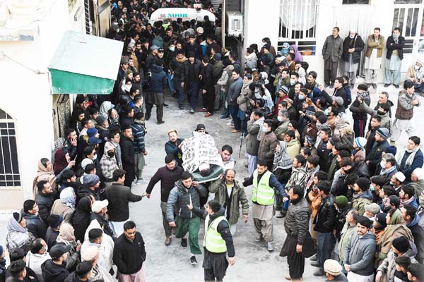 Members of the Shiite Hazara community carry the coffin of a victim after the killing of 11 workers of their community in Quetta, Pakistan.