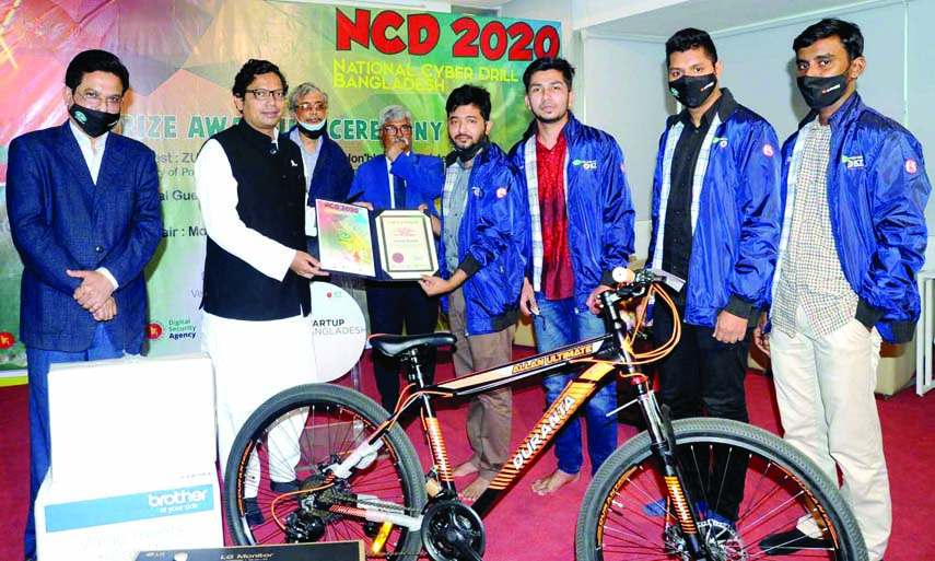 State Minister for ICT Division Zunaid Ahmed Palak distributes prizes among the winners of 'National Cyber Drill-2020' at ICT Tower in the city on Tuesday.