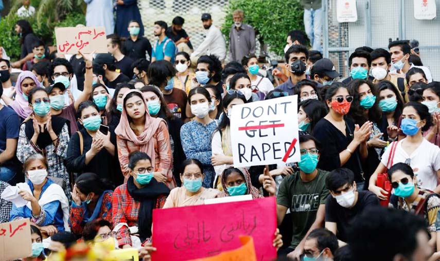 People carry signs against a gang rape that occurred along a highway and to condemn violence against women and girls, during a protest, in Karachi. Agency Photo