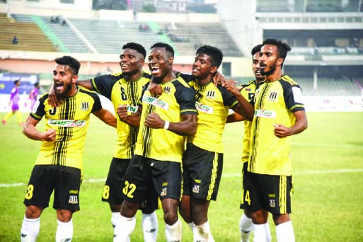 Players of Saif Sporting Club celebrate after defeating Chattogram Abahani Limited by three goals to nil in the first semi-final of the Walton Federation Cup Football at the Bangabandhu National Stadium on Wednesday.