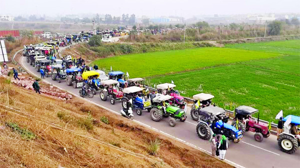 Tractors of protesting farmers reach KMP at Rohtak in Haryana, India on Thursday.