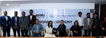 Shamima Nasrin, Chairman of Evaly and Samanzar S Khan, Managing Director of AKS Khan Holdings, exchanging a MoU signing document at AKS Global Trading office in the city on Thursday. Under the deal, customers of Evaly will be able to purchase several prod