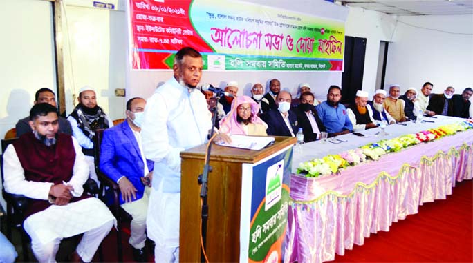 Sylhet City Mayor Ariful Haque Choudhury speaks at a discussion on Saturday marking the fifth anniversary of Holy Somobai Samity's Hasan Market in Bandar Bazar in the city