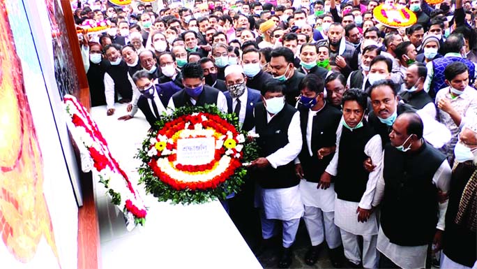 Leaders and activists of Barishal District unit Awami League and its front organisations place floral wreaths on portrait of Bangabandhu Sheikh Mujibur on Sunday marking his historic Homecoming Day.