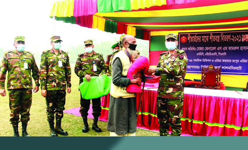 Major General SM Kamrul Hasan, GOC 6 Infantry Division and Rangpur Area Commander, distributes winter clothes among cold-hit people at the Cantonment Public School and College ground under the management of Military Farm Lalmonirhat and at the initiative