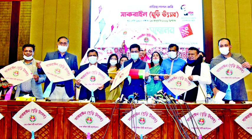 DSCC Mayor Barrister Sheikh Fazle Noor Taposh, among others, exhibits kite after holding a press conference in DSCC auditorium on Tuesday in observance of kite festival.