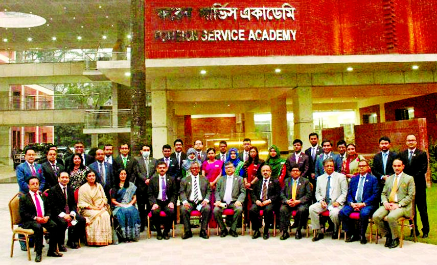 Foreign Secretary Masud Bin Momen and other participants of the 26th specialized diplomatic training course pose for a photo session in front of the Foreign Service Academy on Monday.