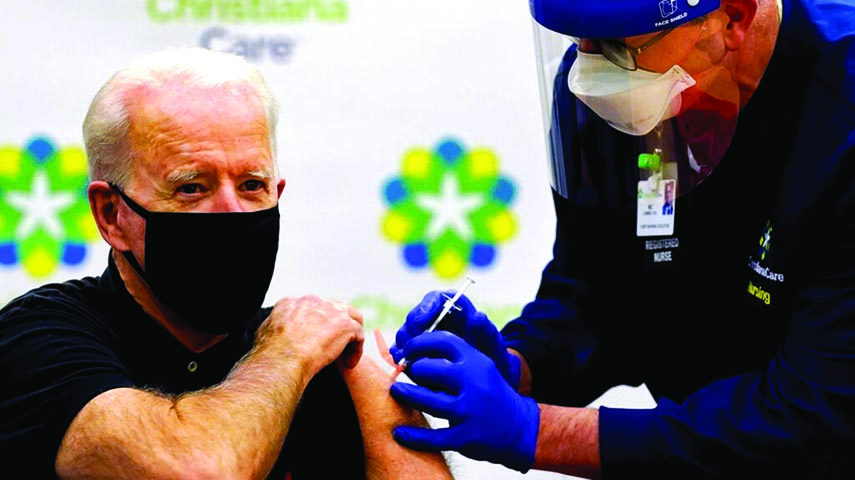 US President-elect Joe Biden receives the second course of the Pfizer-BioNTech Covid-19 vaccine at Christiana Hospital in Newark, Delaware, administered by Chief Nurse Executive Ric Cuming.