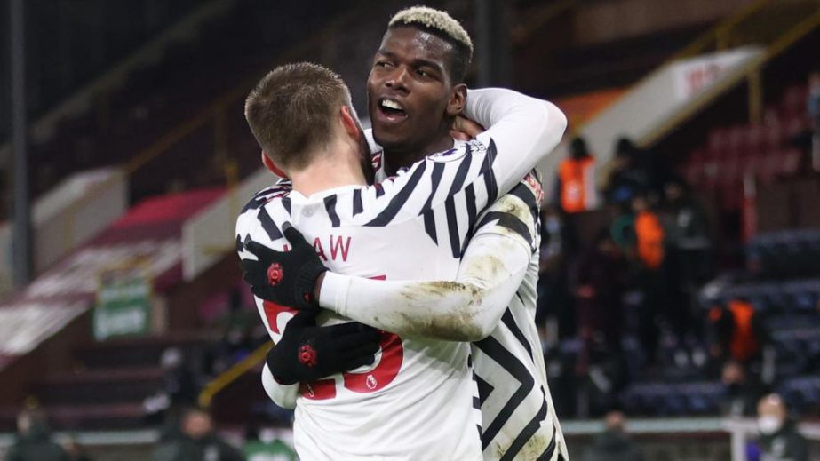 Manchester United's Paul Pogba (behind) celebrates scoring their first goal against Burnley in a Premier League match at Turf Moor in Burnley on Tuesday.