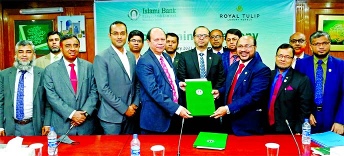 Md Mosharraf Hossain, Deputy Managing Director of Islami Bank Bangladesh Limited, and Quazi A S M Anisul Kabir, Chief Executive Officer of Hotel Royal Tulip, exchanging documents after signing a Memorandum of Understanding (MoU) at the bank's head office
