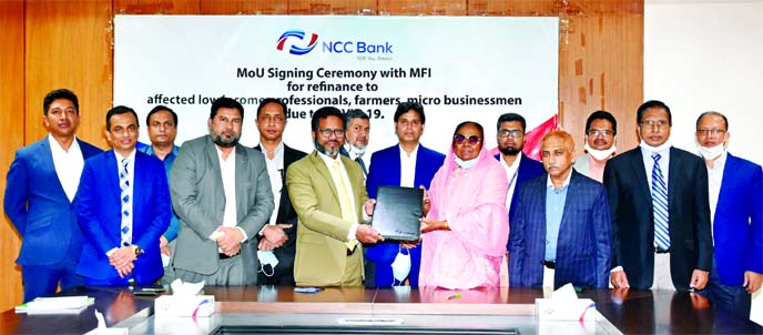 Mohammad Mamdudur Rashid, Managing Director & CEO of NCC Bank and Prof Dr Hosne-Ara Begum, Executive Director of TMSS, exchanging documents after signing a Memorandum of Understanding (MOU) at the bank's head office in the city recently. The agreement is