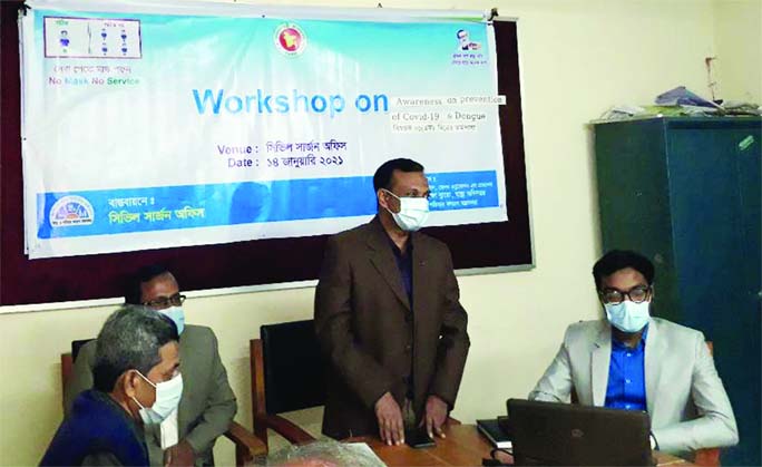 Suzat Ahmed, Civil Surgeon (CS) of Gopalganj, speaks at the day-long workshop on awareness on prevention of Covid-19 and Dengue at Civil Surgeon office in the district on Thursday, arranged by Lifestyle, Health Education and Promotion, Health Educ