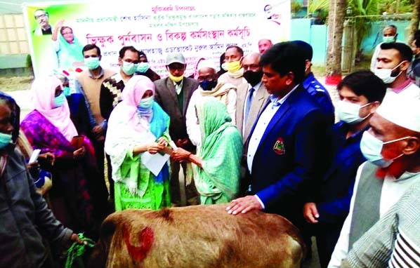 UNO Fahmida Huque is seen handing over nine cows and cash Tk 8, 760 to each of nine beggars of 9 Wards in Matlab Paurasava at a simple ceremony held at Matlab Upazila in Chandpur as a gift of Mujib Borsho on Monday last.