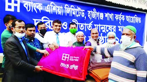 Officials of Bank Asia Ltd in Hajiganj Branch led by Managaer Sanjoy Das distributed 500 pieces of blankets among the cold hit poor and destitute people at a function held on the premises of Children's Academy in Hajiganj of Chandpur district o