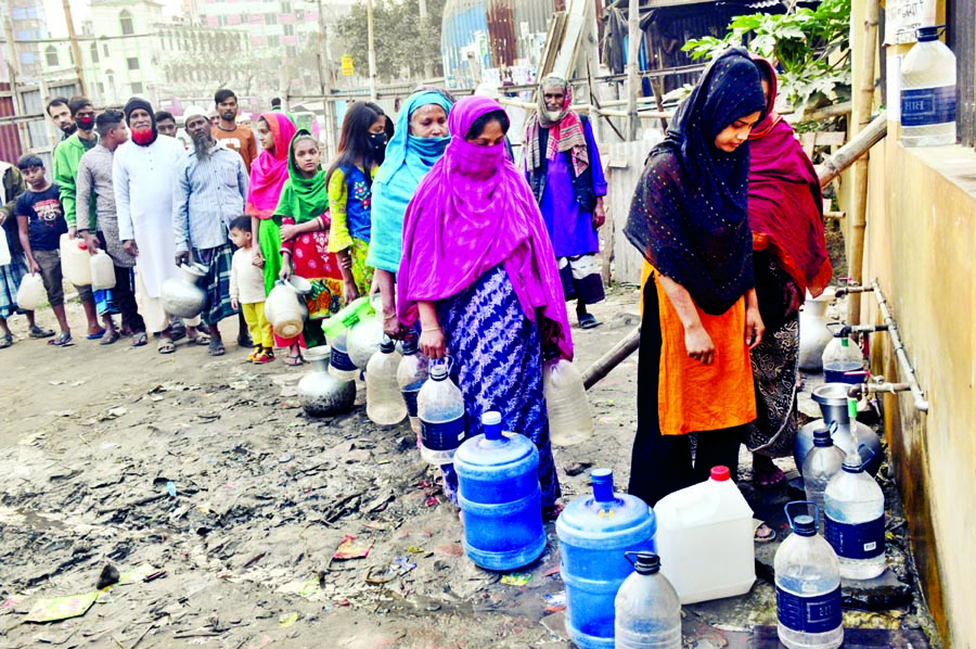 Residents of Jatrabary's Chhantak in the city collecting drinking water from deep tube well since the WASA water is polluted. The photo was taken on Sunday.