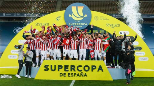 Athletic Bilbao players celebrate after winning the Spanish Super Cup final football match between FC Barcelona and Athletic Club Bilbao at La Cartuja stadium in Seville on Sunday.