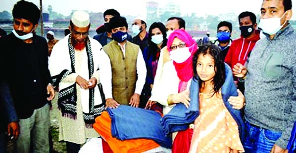 Chandpur DC Anjana Khan Mojlish distributes blankets among the cold-hit Gypsy families in the town recently.