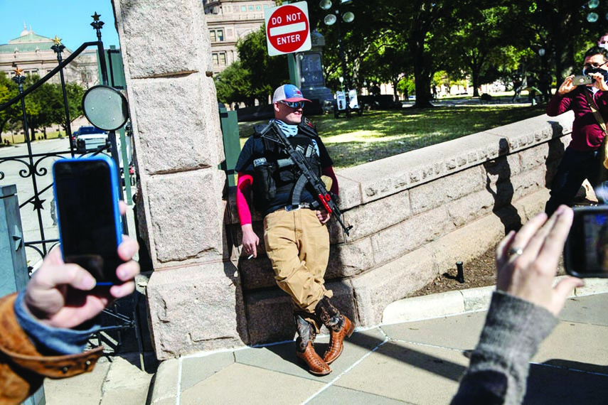 An armed demonstrator standing outside the Texas State Capitol in Austin on Sunday.