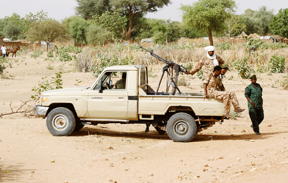 A convoy of Sudanese security forces deploy during a rally in al-Geneina, the capital of the West Darfur state.
