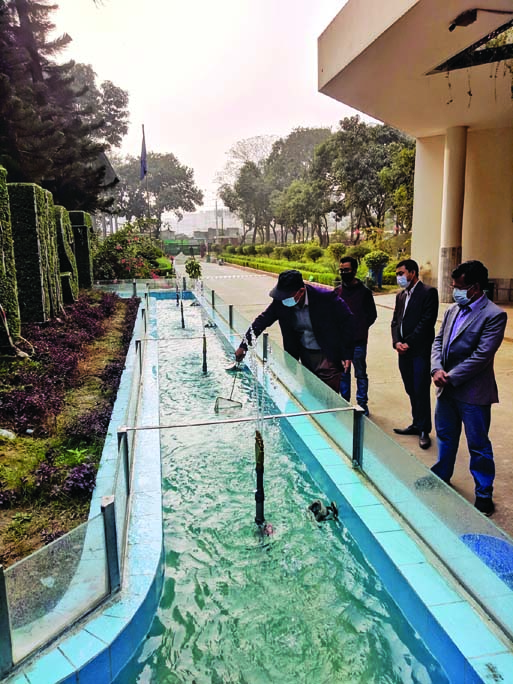 DG of National Science and Technology Museum Munir Chowdhury releases fish fries in the fountain of the museum in the city's Agargaon on Sunday.