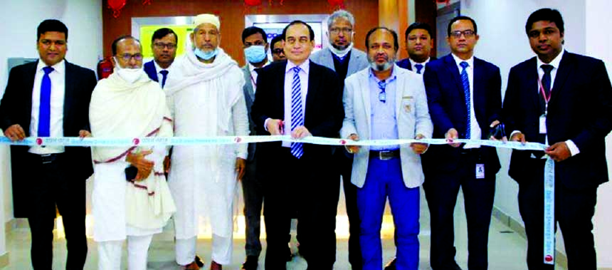 M. Fakhrul Alam, Managing Director of ONE Bank Limited, inaugurating its sub-branch at Zirani Bazar in Ashulia in Savar on Wednesday. High officials of the bank and local elites were also present.