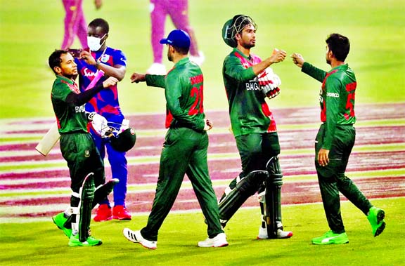Players of Bangladesh celebrating after their success in the first One Day International (ODI) match against the Caribbean team in the Bangabandhu Bangladesh-West Indies three-match ODI series at the Sher-e-Bangla National Cricket Stadium in the city's M
