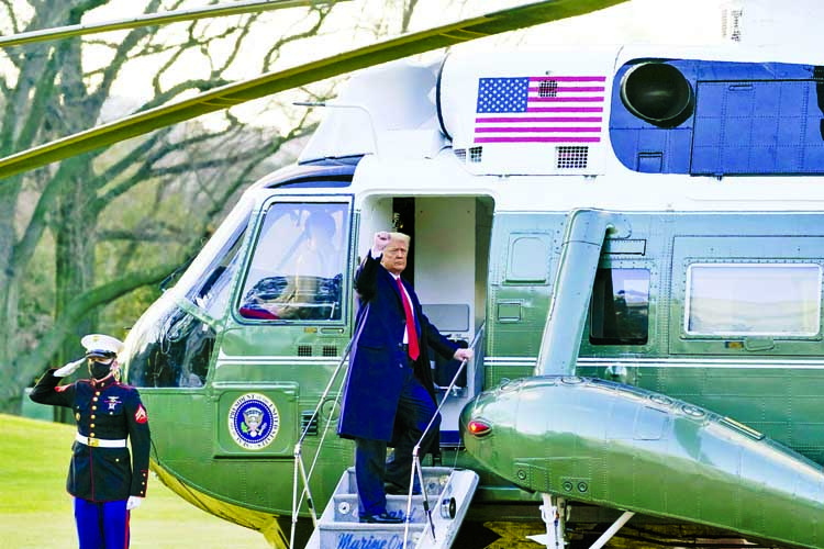 President Donald Trump gestures as he boards Marine One on the South Lawn of the White House on Wednesday.